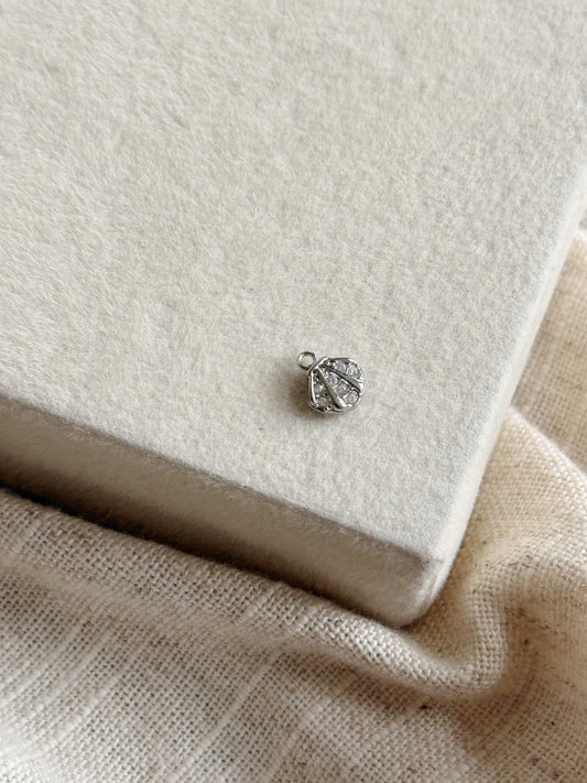 Silver shell charm